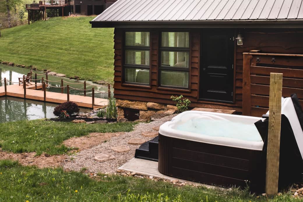 Pond slider studio cabin hot tub