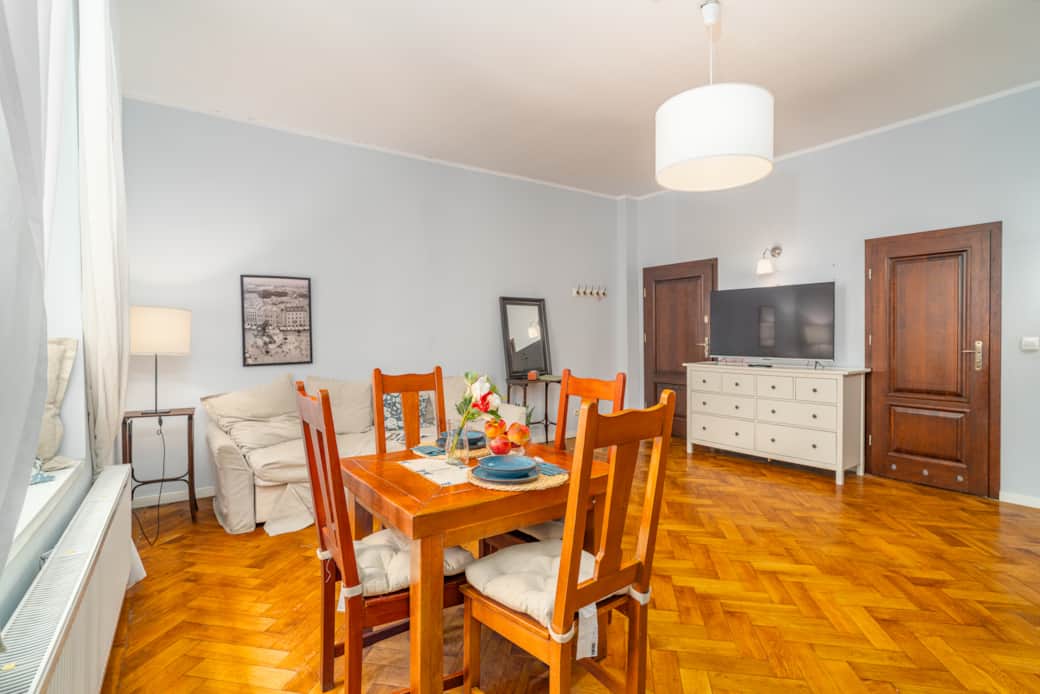 Spacious, calming bedroom with two beds, soft lighting, and a comfortable, serene setup.