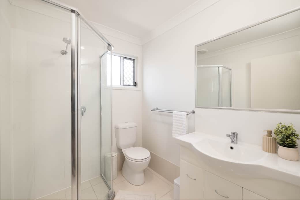 Bathroom: Stylish bathroom with walk-in shower, vanity, and clean finishes 