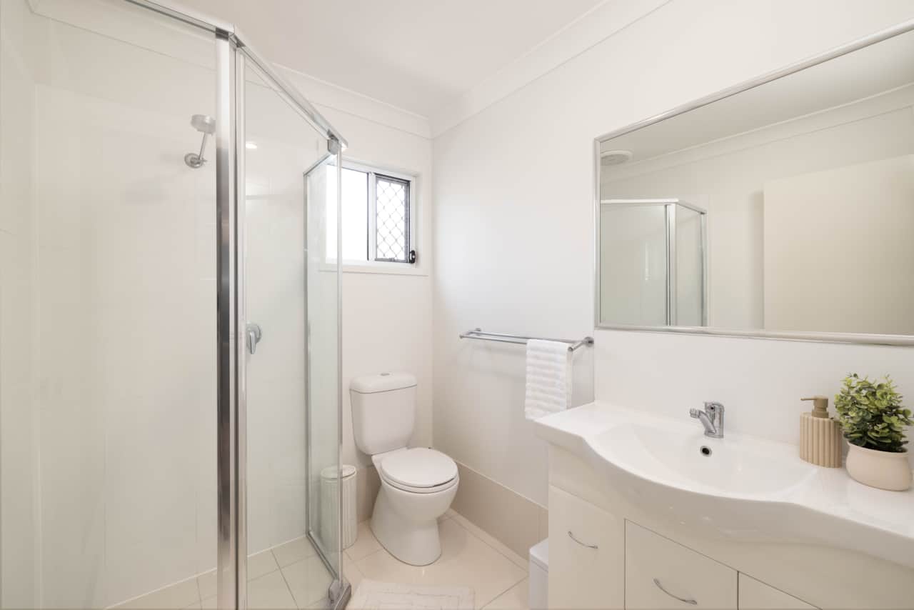 Bathroom: Stylish bathroom with walk-in shower, vanity, and clean finishes 