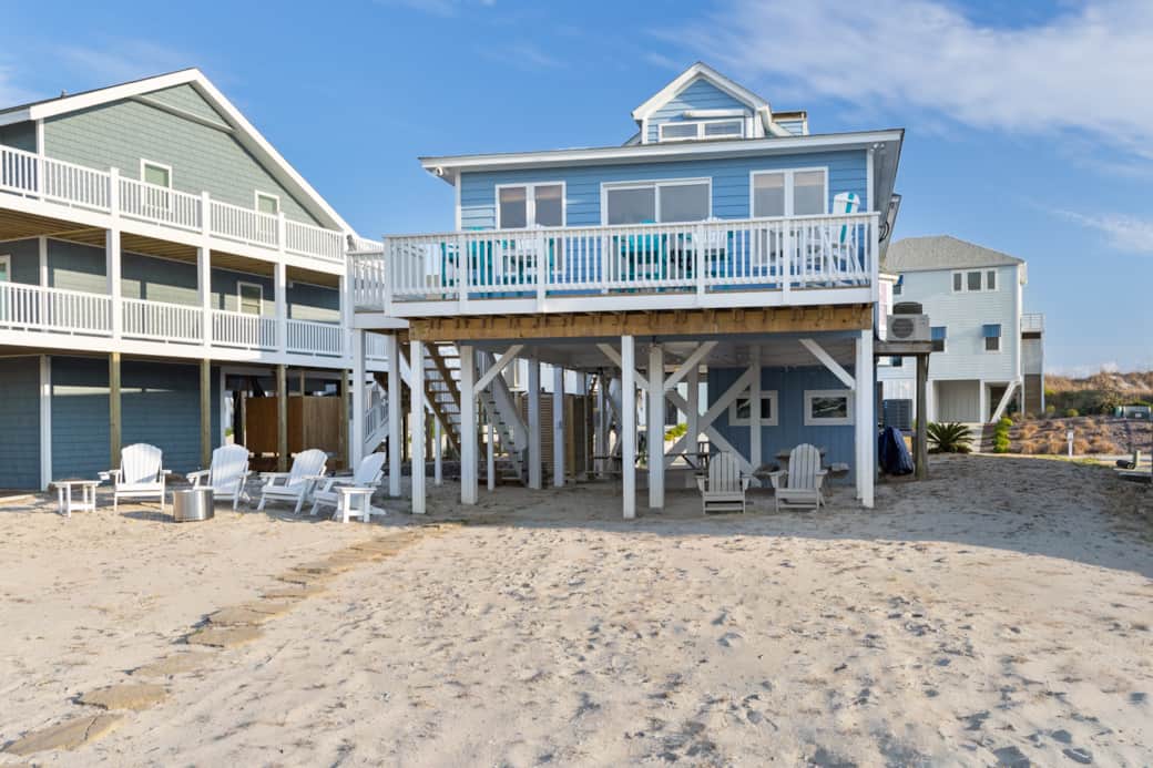 Backyard ready for beach games while others fish off the dock Backyard ready for beach games while others fish off the dock