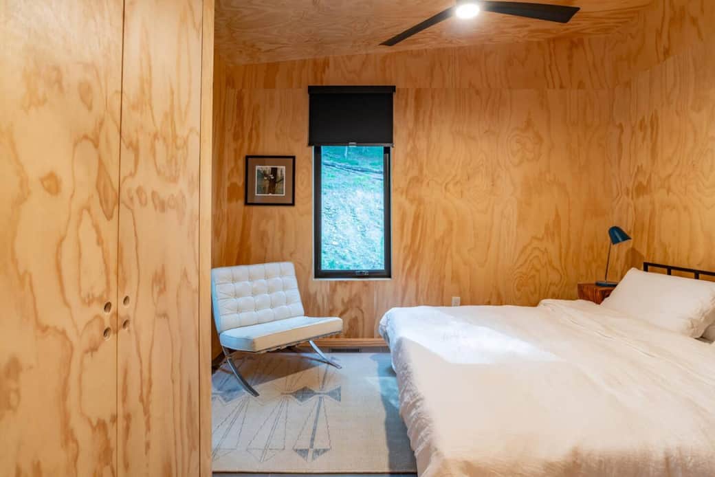 The Hemwood's king size bed awaits in this modern, Scandinavian-inspired space. Featuring chic plywood walls, a ceiling fan, and overhead lighting for comfort and style. Sleeps 2.