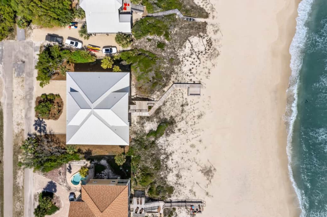 Aerial of home showing very close to the beach with short boardwalk. Aerial of home showing very close to the beach with short boardwalk.