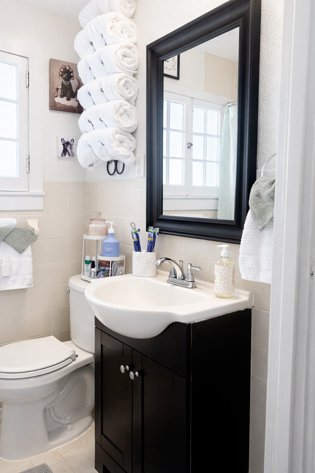 Cozy full bathroom with tub, hand shower, and premium bath essentials
