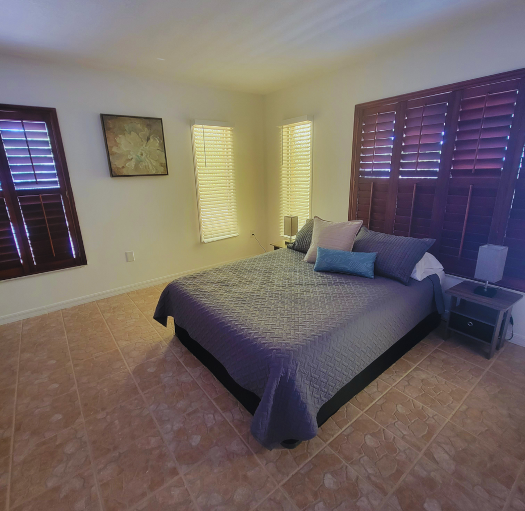 Inviting queen bed with plush pillows, elegant decor, and warm natural light. Lakeland, FL Inviting queen bed with plush pillows, elegant decor, and warm natural light. Lakeland, FL