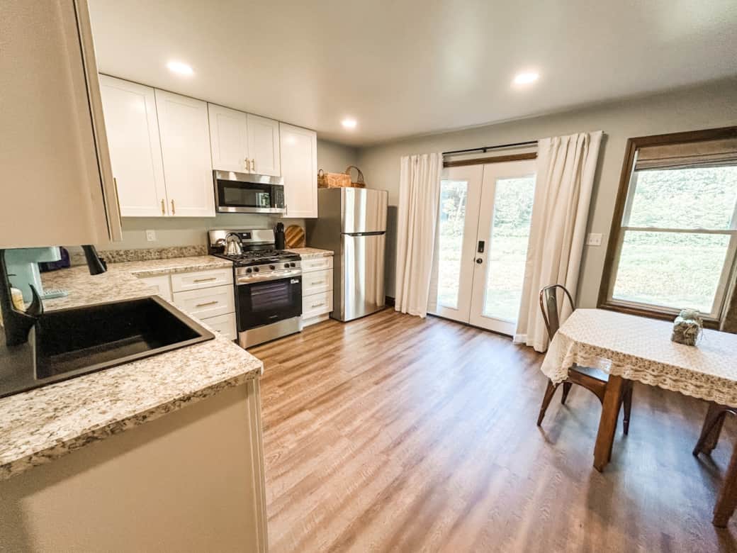 Prepare meals your way with a stove, fridge, microwave, and cookware provided.