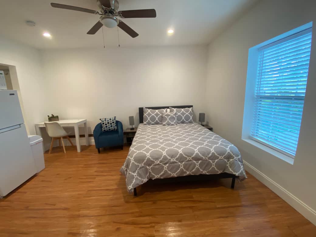 The bedroom features a queen-size bed, a desk, an accent chair and a great lighting. Lakeland, FL
