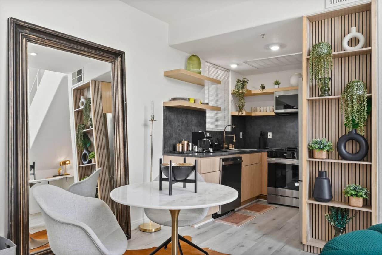 Cozy dining nook complete with a marble bistro table and seating for two.