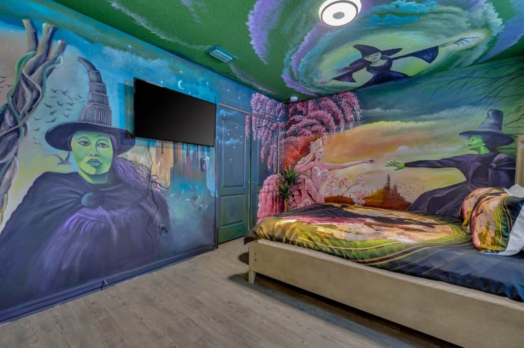 Step into a Wicked-themed dreamscape with floor-to-ceiling murals, glowing colors, custom bedding, and smart TV. A guest-favorite room that photographs beautifully and transforms nights into pure magic. Featured in creator content during a past stay
Step into a Wicked-themed dreamscape with floor-to-ceiling murals, glowing colors, custom bedding, and smart TV. A guest-favorite room that photographs beautifully and transforms nights into pure magic. Featured in creator content during a past stay