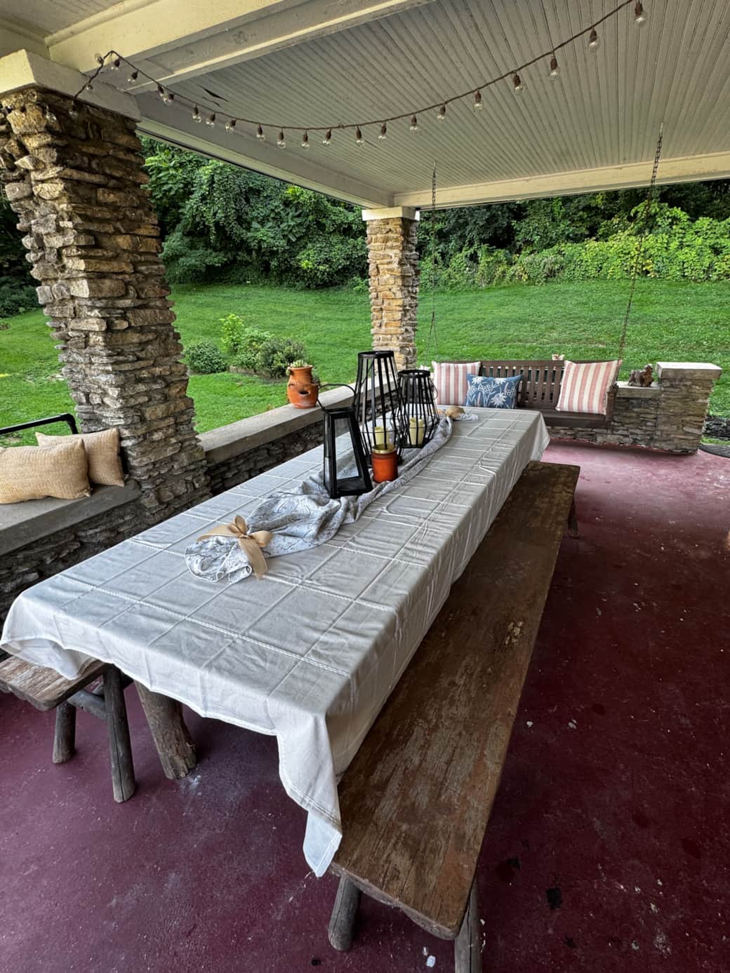 Front porch swing and large dining table