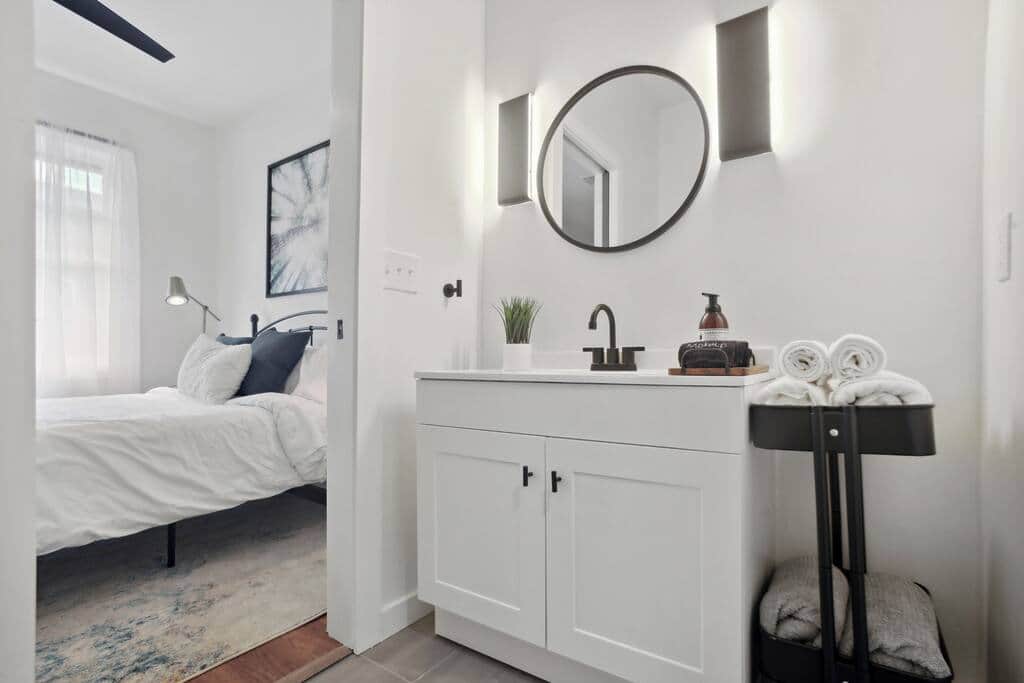 Walk into the bathroom that provides a sliding door for privacy
