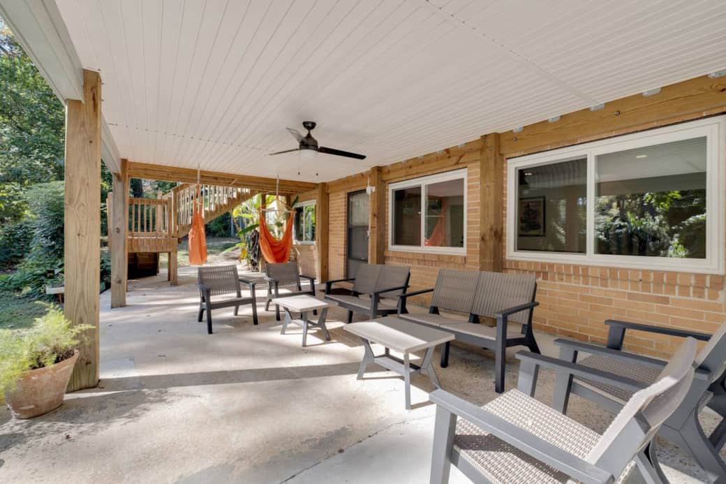 Huge covered patio with seating.  NOTE: DO NOT USE GRILL UNDER COVERED PATIO. THE SMOKE WILL STAIN THE VINYL COVERING.