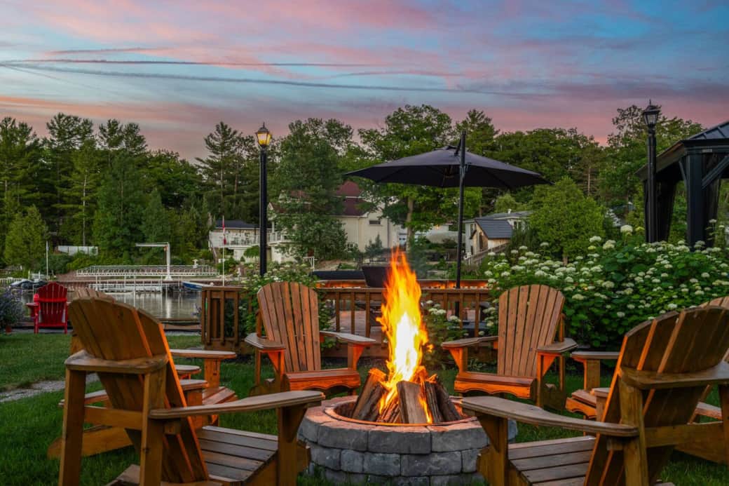 Gather friends around a cozy firepit with a mesmerizing river view. Enjoy the warmth of the flames, the soothing sounds of the flowing water, and the company of good friends. Gather friends around a cozy firepit with a mesmerizing river view. Enjoy the warmth of the flames, the soothing sounds of the flowing water, and the company of good friends.