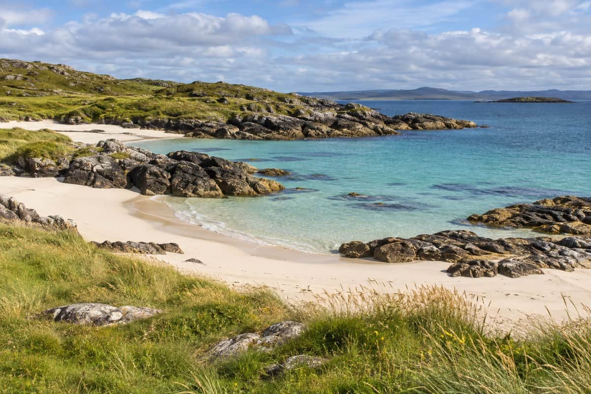 AI illustration: pale sandy Hebridean cove and clear turquoise shallows