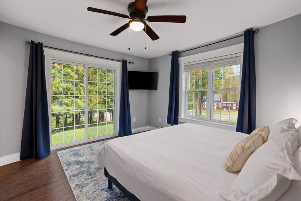 Snuggle up to watch your favorite show at night by closing the blackout curtains. Keep an eye out for neighbor chickens through the sliding glass door.