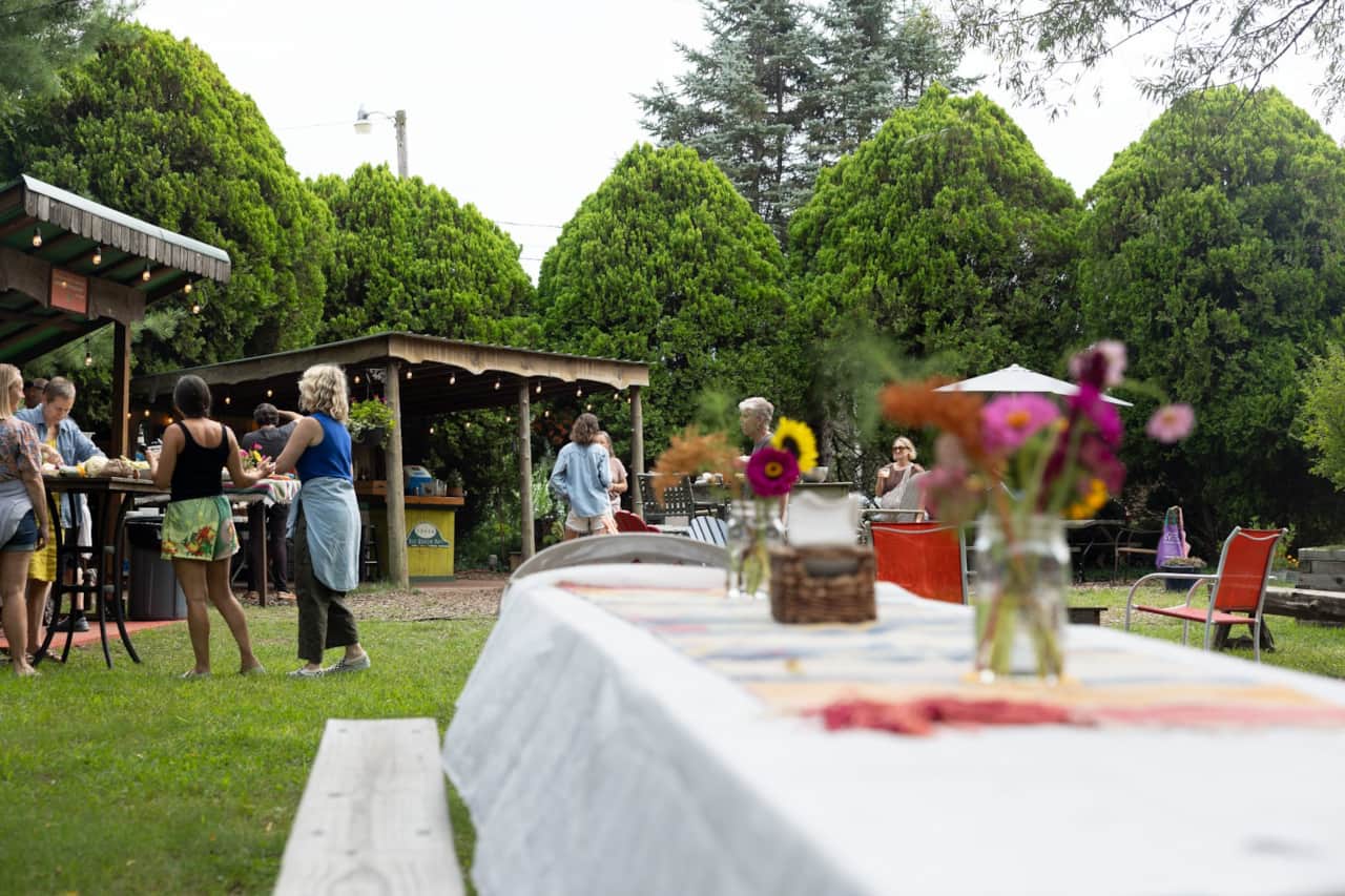 A long-table dinner under the trees