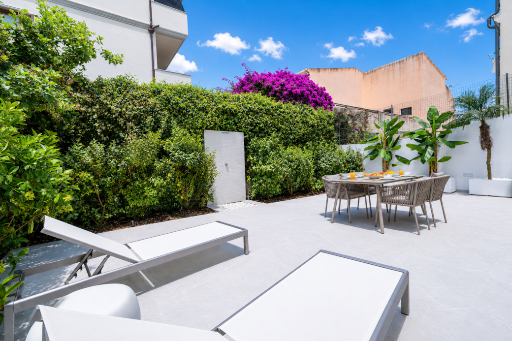 AZULIS DelleTerme Suites Apartment1 open outdoor terrace area with rain shower and 4 person dining t AZULIS DelleTerme Suites Apartment1 open outdoor terrace area with rain shower and 4 person dining t