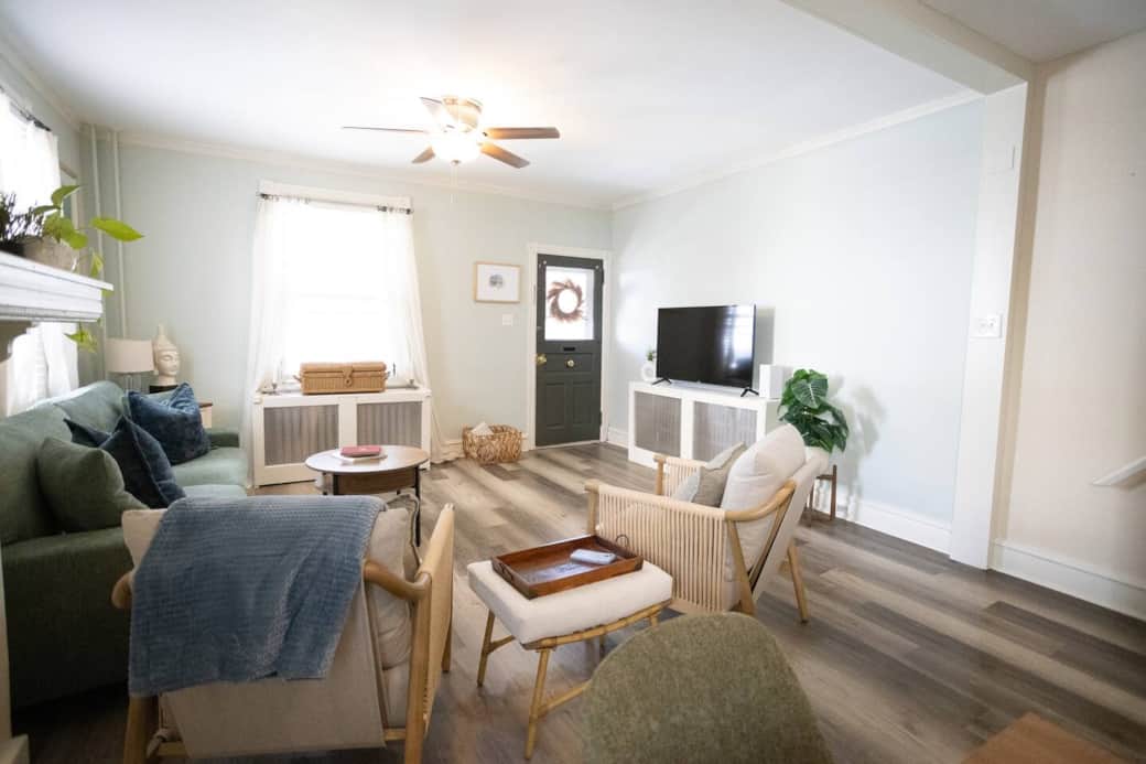 Relax and unwind in this bright, comfortable living room featuring a 50-inch Smart TV, soft seating, and warm natural light. Perfect for movie nights or cozy evenings in after exploring town.