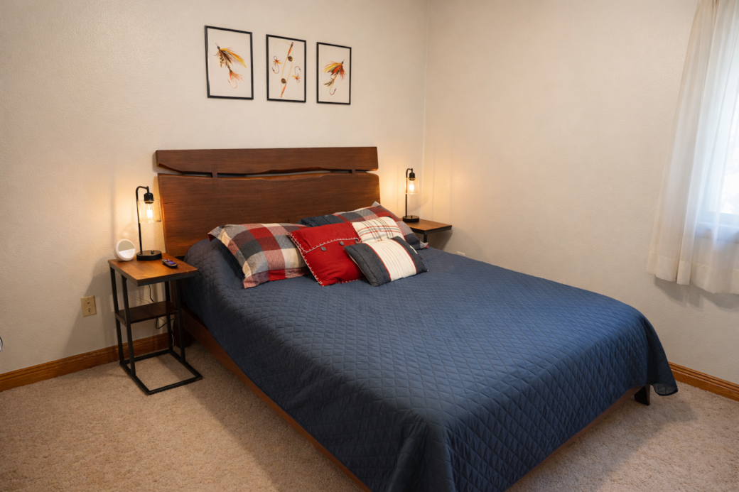 Comfortable queen bedroom with 40″ Roku TV and closet storage. Comfortable queen bedroom with 40″ Roku TV and closet storage.