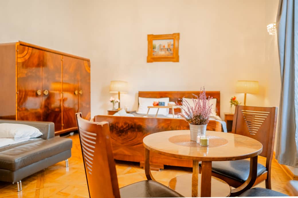 The space is elegant and harmonious, featuring classic wooden furniture.