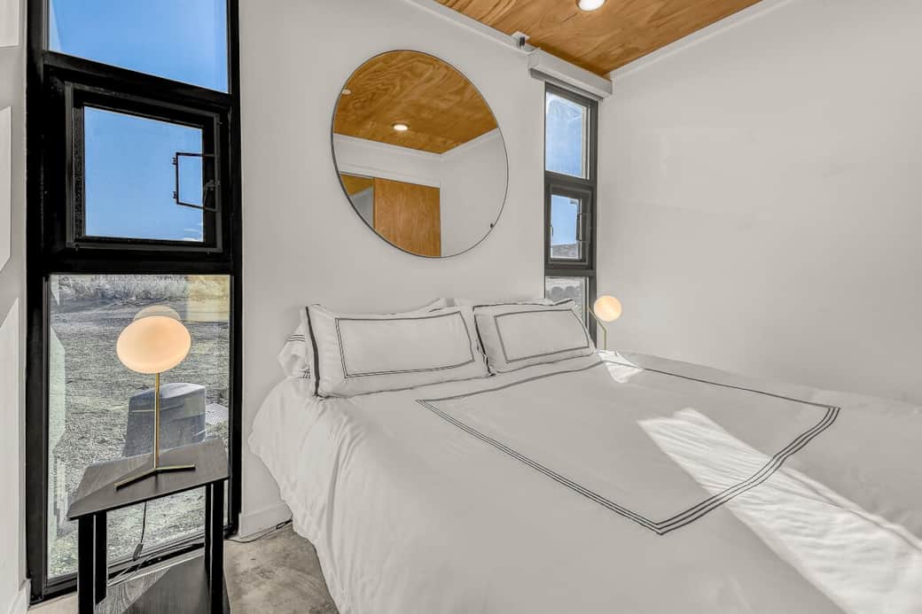 Bedroom.  The shades are electric, there's a button to put them up & down. They are very dark when down.