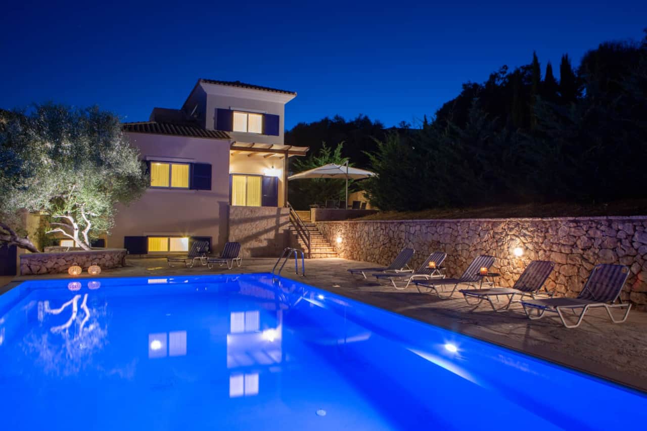 Pool with villa in night