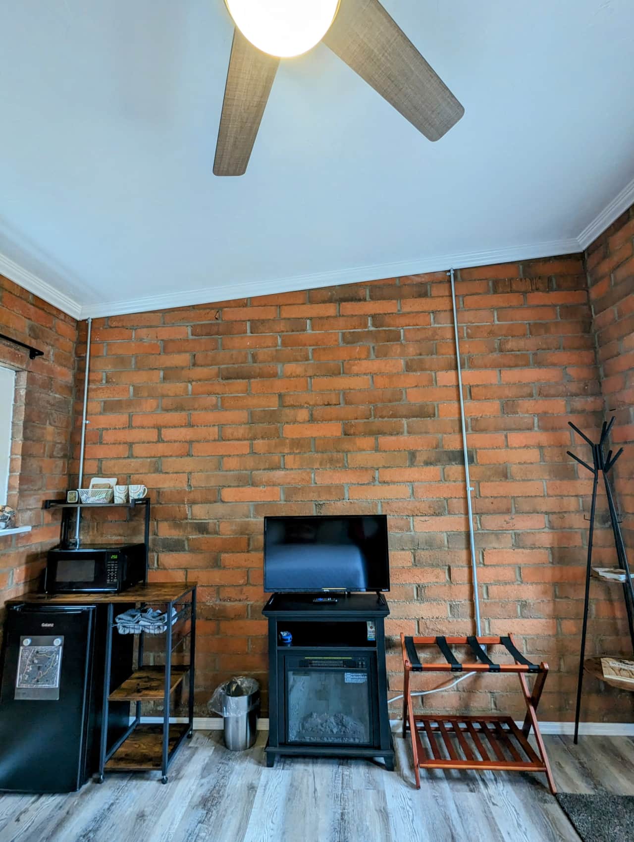 Refrigerator, microwave, smart TV, A/C, and electric fireplace.