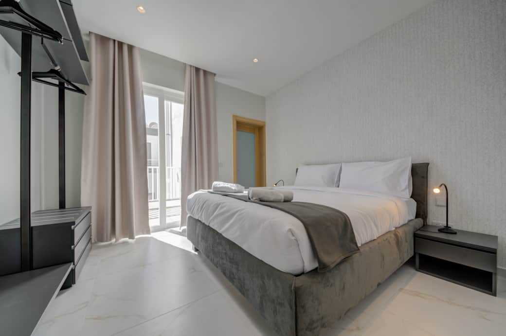 The elegant king bed is the perfect place to rest your head after a day of Malta adventures The elegant king bed is the perfect place to rest your head after a day of Malta adventures