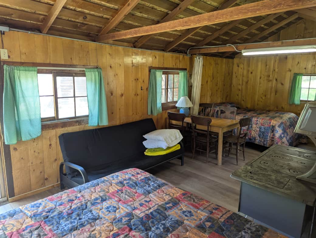 Cabin 3 features two full size beds and a futon.