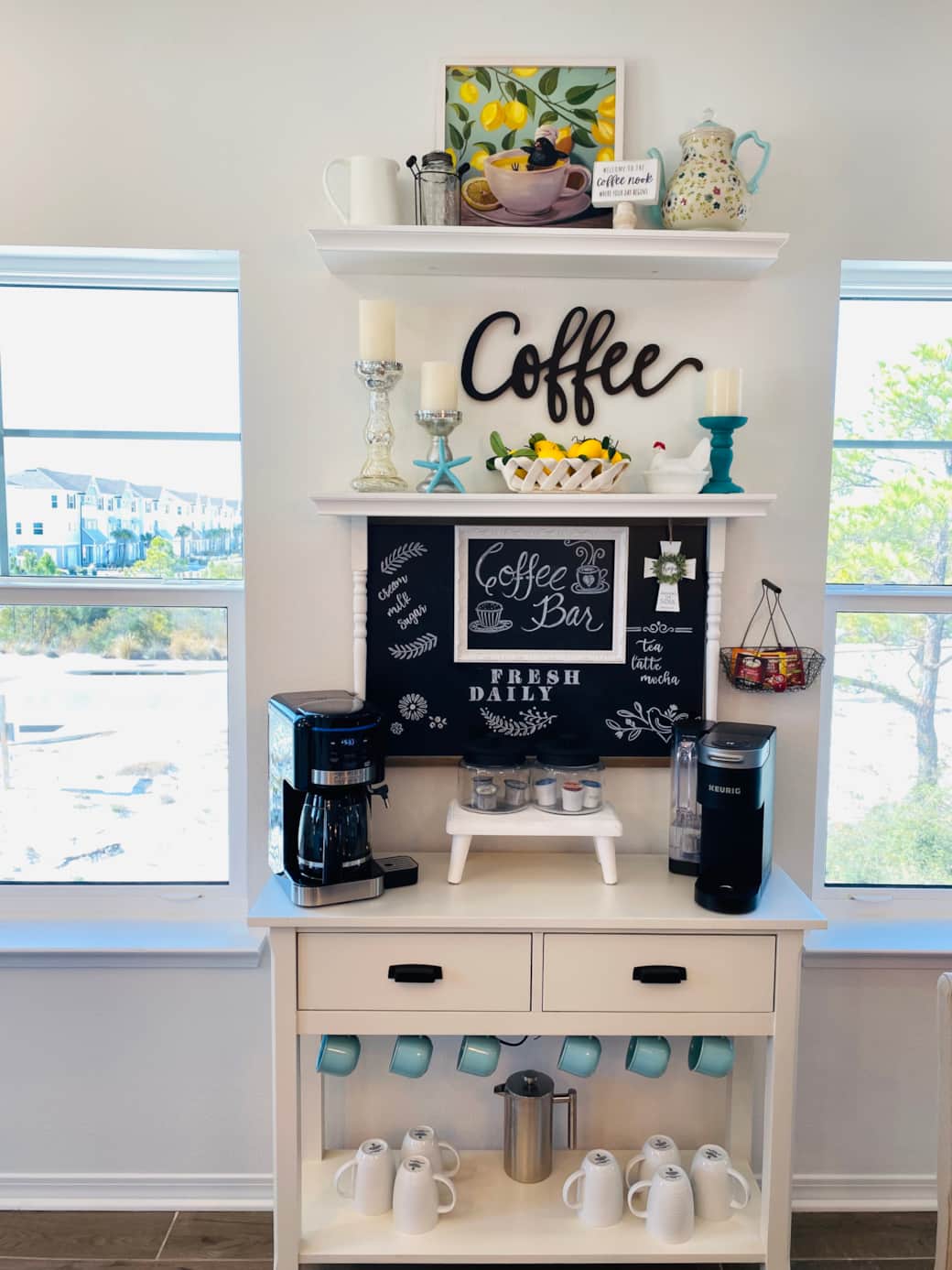 Coffee bar features a Keurig, drip maker and steamed water dispenser for tea