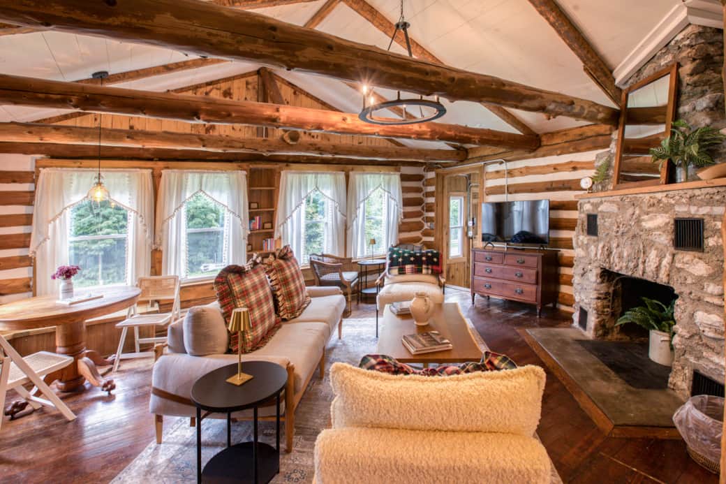 Relax in our cozy living room, decorated with rustic Americana charm and a warm stone fireplace.