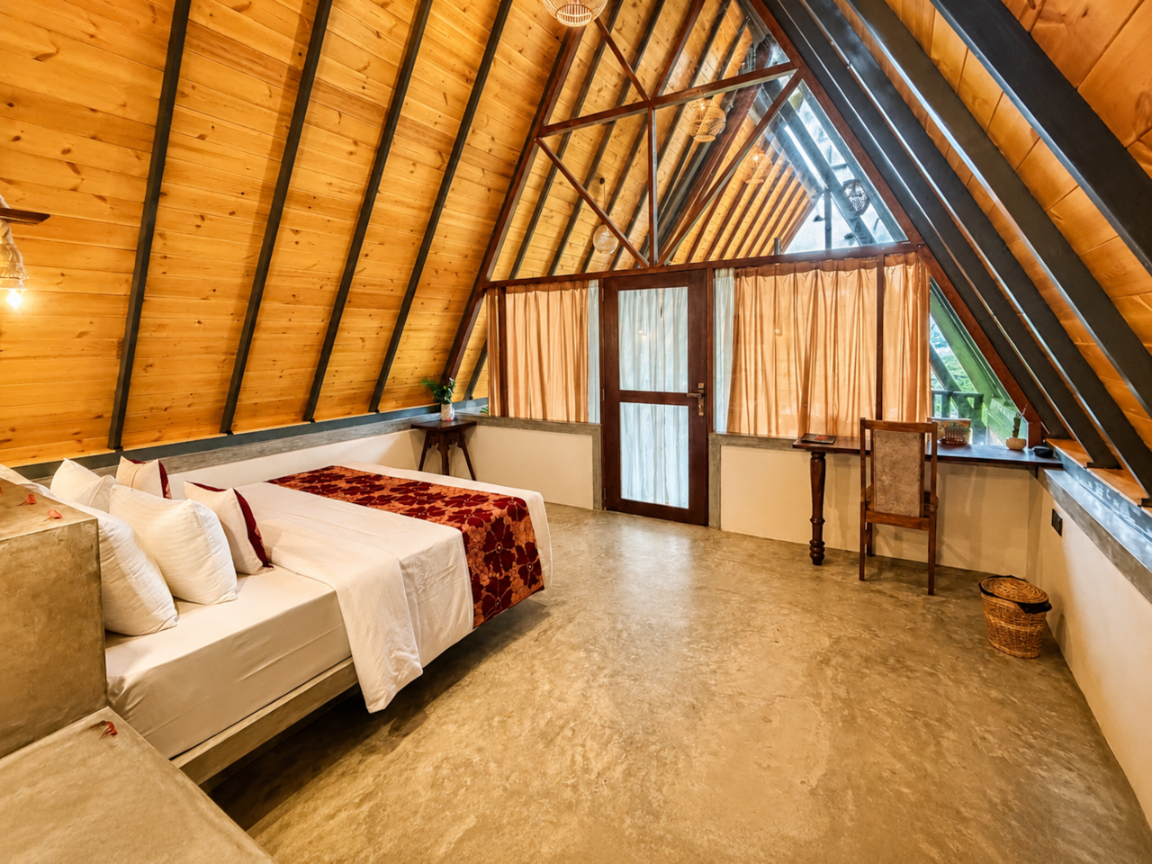 Quiet bedroom beneath the high timber roof