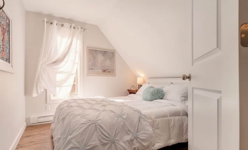 Welcome to the Lobster Loft, featuring a unique stained glass lobster window and comfy Queen bed