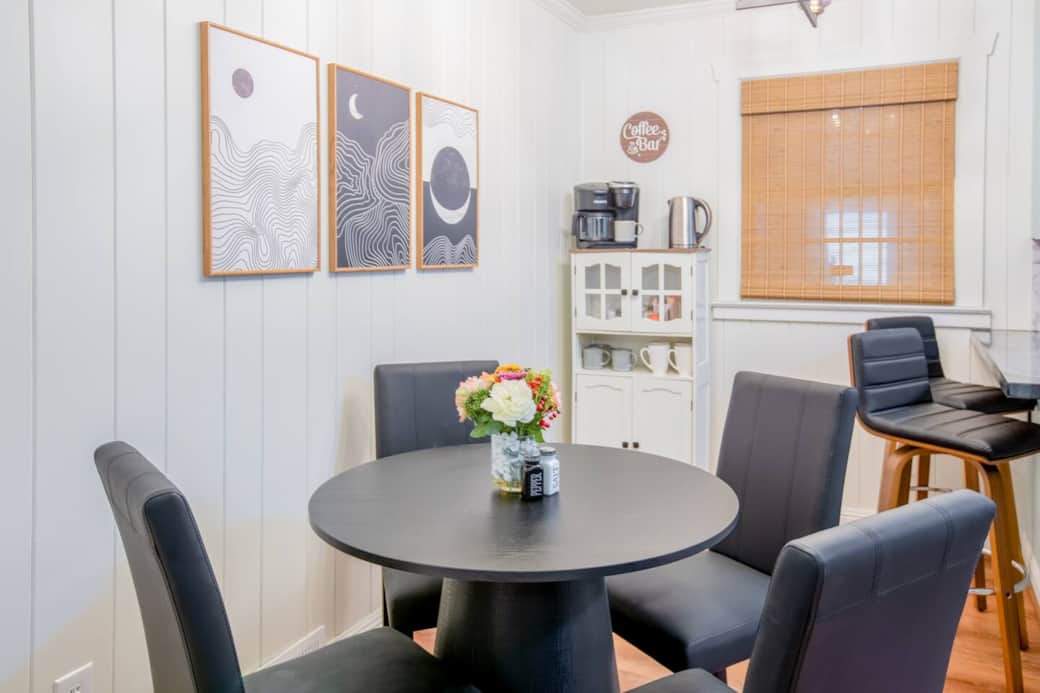 The dining area offers comfortable seating for six guests four at the dining table and two more at the bar counter with stools seating. It’s the perfect setup for family meals, casual breakfasts, or enjoying coffee from the nearby coffee station.