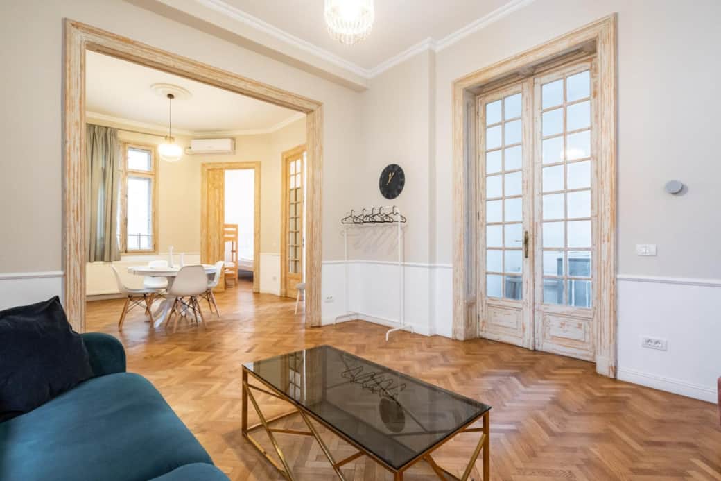 Spacious living room in Central Bucharest apartment with high ceilings and natural light Spacious living room in Central Bucharest apartment with high ceilings and natural light