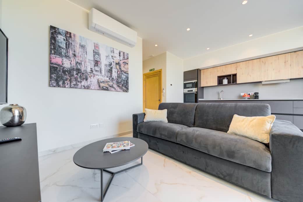 Sink into our comfortable sofa and relax in our inviting living room Sink into our comfortable sofa and relax in our inviting living room