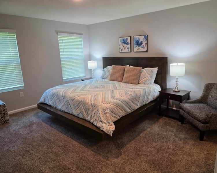 Comfortable bedroom featuring a cozy king bed creates a peaceful atmosphere for restful nights. Comfortable bedroom featuring a cozy king bed creates a peaceful atmosphere for restful nights.