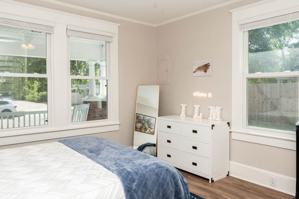 Master Bedroom featuring a queen size bed with a tempur-pedic topper and private attached 1/2 bath
