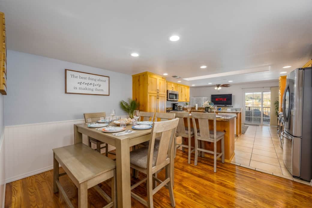 Spacious and welcoming dining area seamlessly connected to the kitchen, featuring comfortable seating for eight—perfect for family meals or entertaining guests. Spacious and welcoming dining area seamlessly connected to the kitchen, featuring comfortable seating for eight—perfect for family meals or entertaining guests.