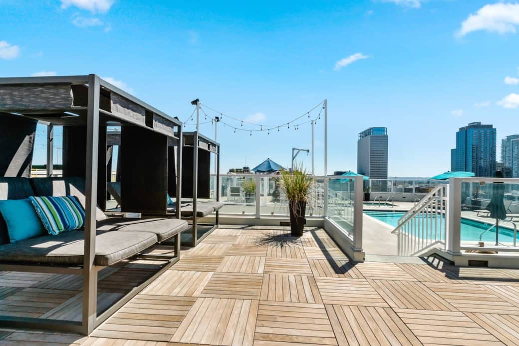 Rooftop bliss with comfy lounge chairs, offering a serene and elevated relaxation spot.
