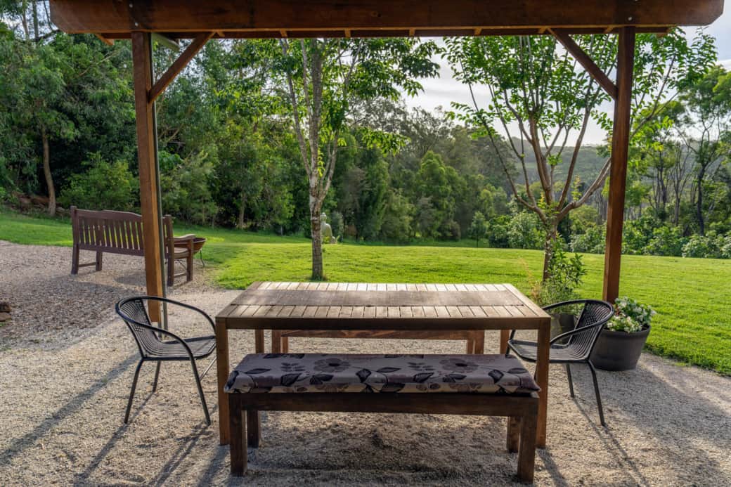 Cottage covered patio for outdoor dining, morning coffee and quiet garden outlooks Cottage covered patio for outdoor dining, morning coffee and quiet garden outlooks