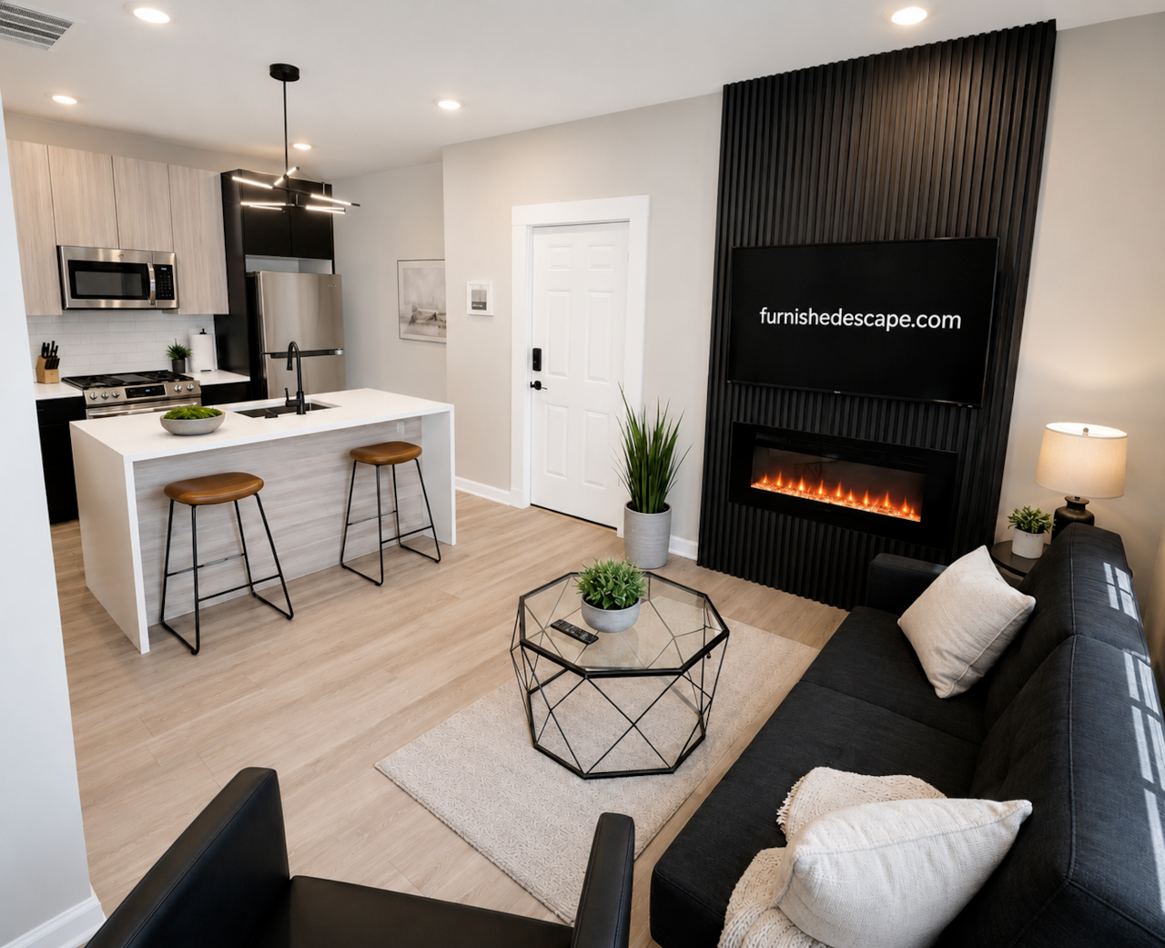 Modern living room with a comfortable futon sofa bed, large flatscreen TV, stylish seating, and an open-concept layout. Perfect for relaxing after a day exploring the city, with a fully equipped kitchen and comfortable space for families or groups
