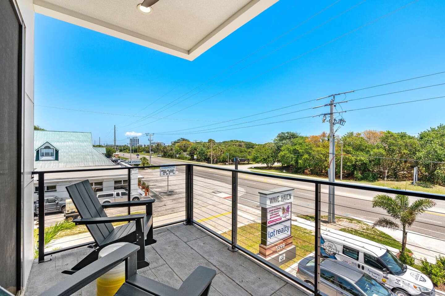 Enjoy a peaceful moment on the balcony, surrounded by palm trees and fresh air.