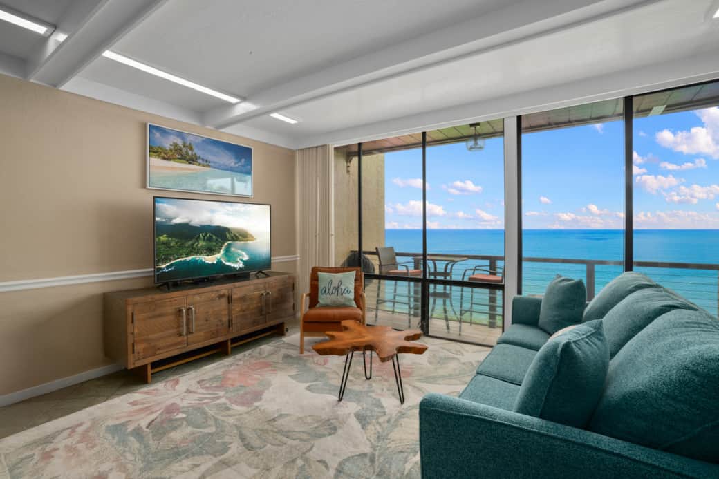 Relaxing living space with panoramic ocean views and warm island touches