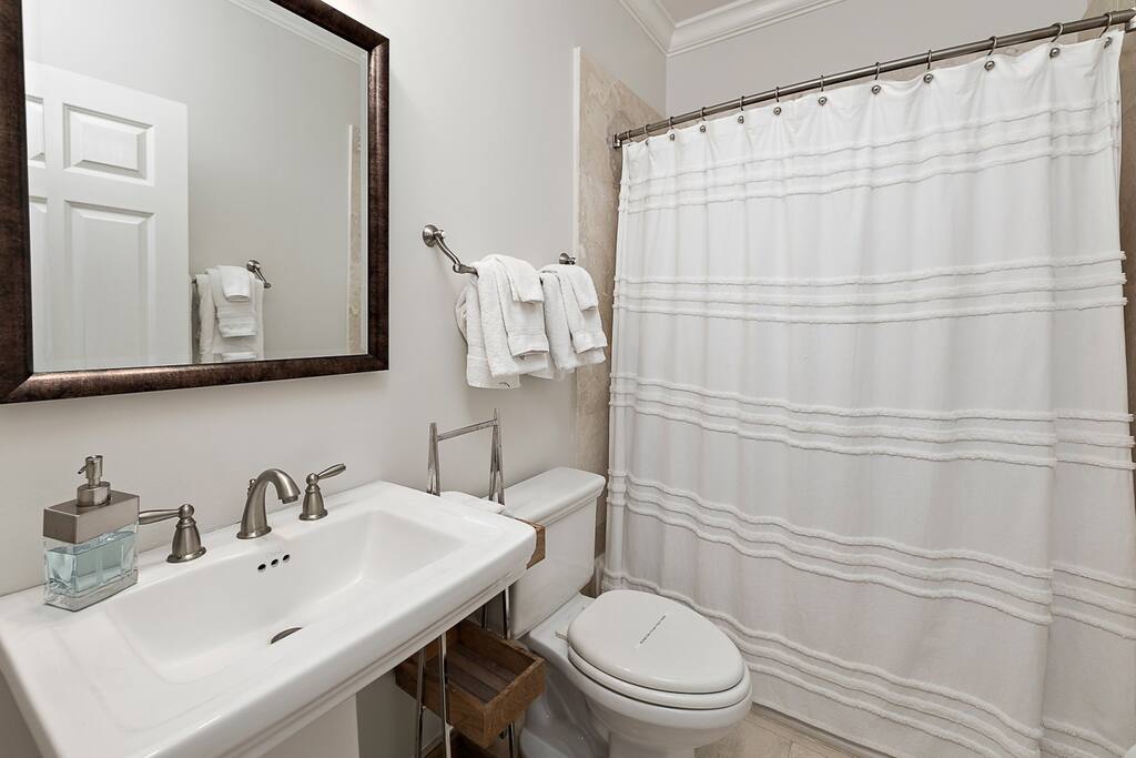 En suite with tub/shower attached to fourth floor twin bedroom.