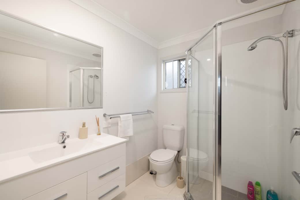 Bathroom: Stylish bathroom with walk-in shower, vanity, and clean finishes 