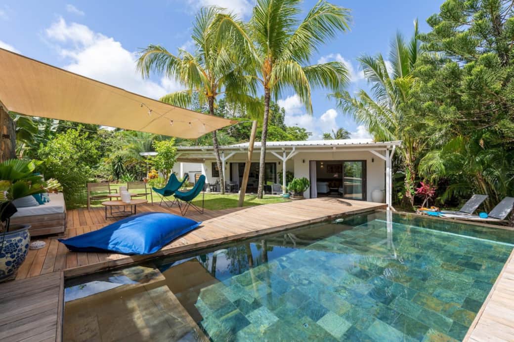 Pool overlooking outdoor lounge and terrace