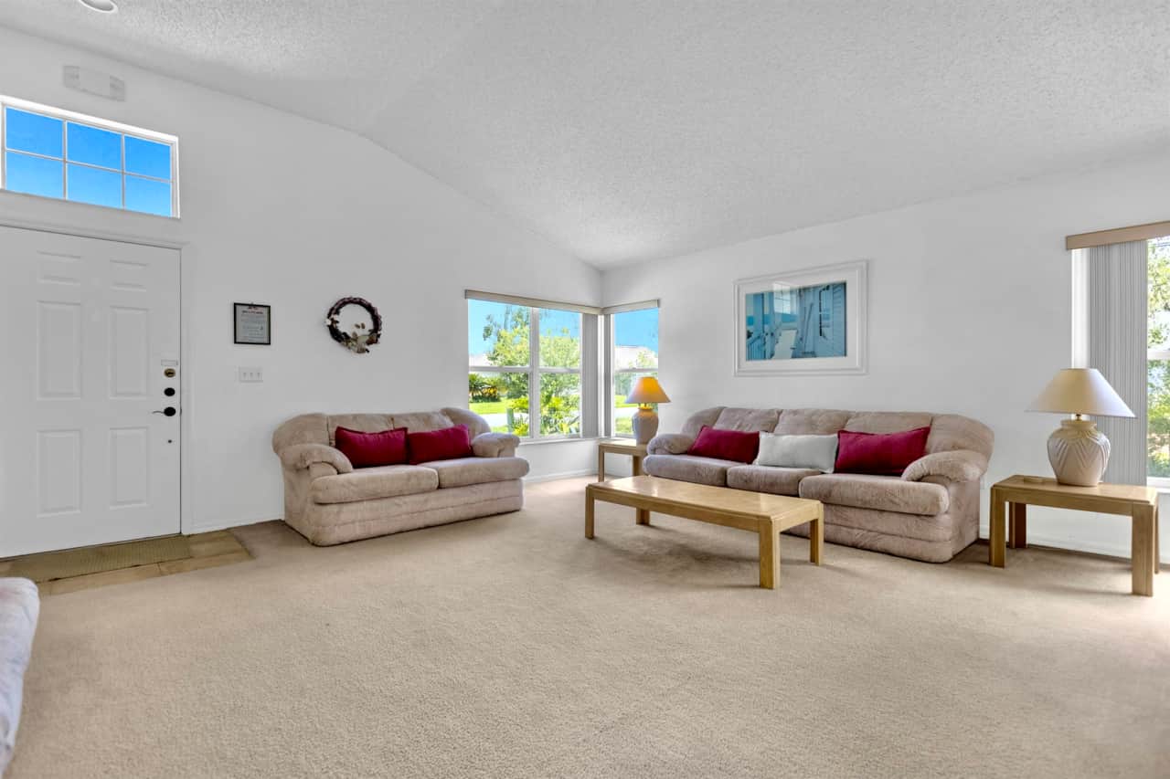 A more formal large living area for family gatherings with plenty of seating