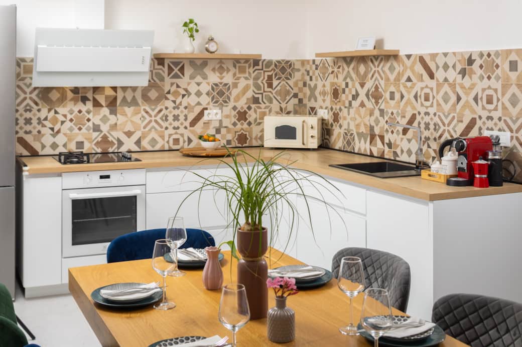 Gather around! Our inviting kitchen and dining area, perfectly set for memorable meals. Photo 3: Ov Gather around! Our inviting kitchen and dining area, perfectly set for memorable meals. Photo 3: Ov