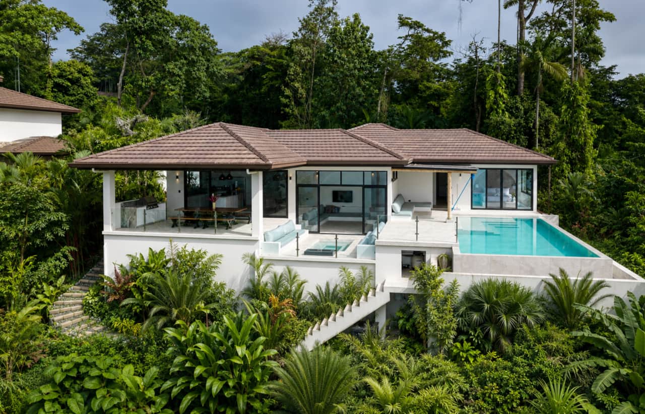 A private jungle villa with bright pools and seamless indoor-outdoor living